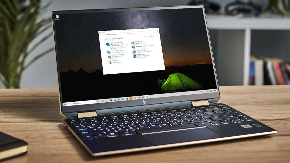 Windows laptop showing the Control Panel on the desktop