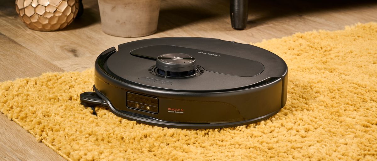 Roborock Qrevo Master robot vacuum on a rug