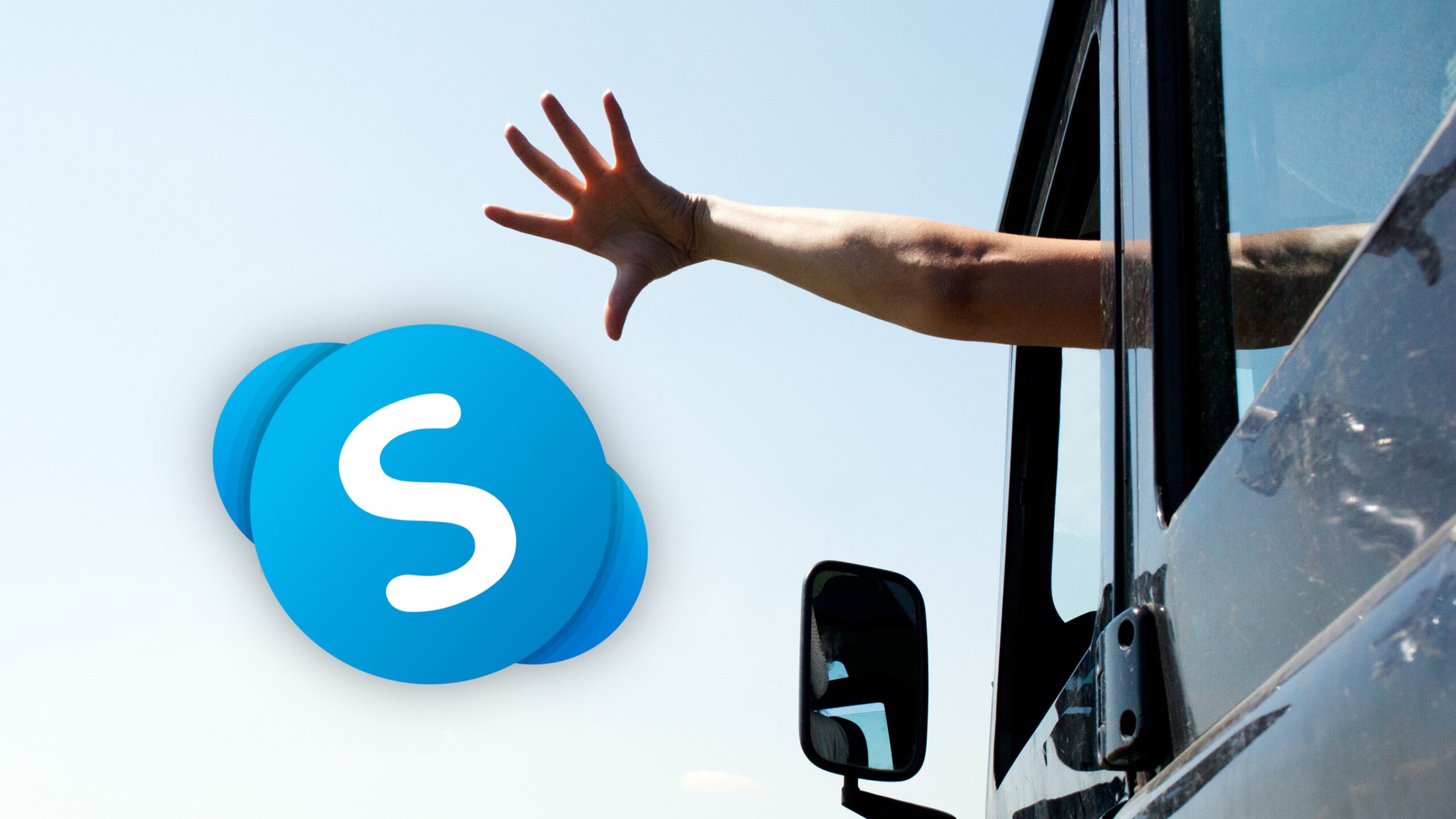 A hand 'throwing' the Skype logo out of a car window.