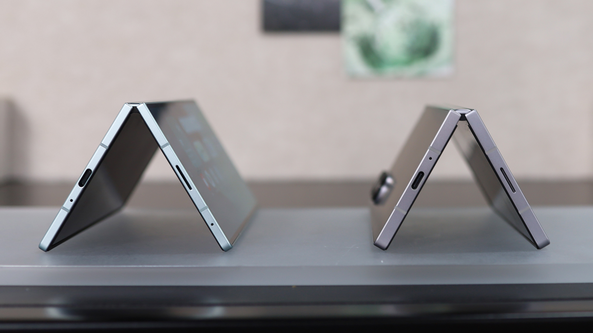 Samsung Galaxy Z Fold 7 next to the Z Fold 6, both bent in a V