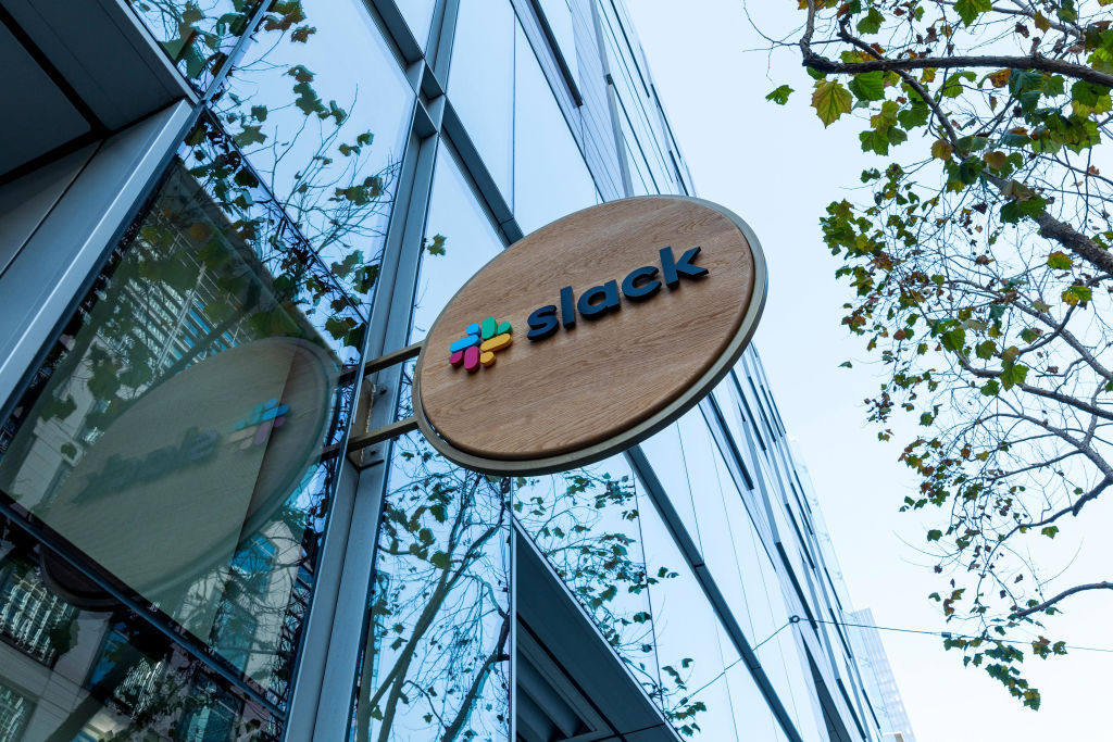 Signage for Slack Technologies Inc. at the company's headquarters in San Francisco, California, U.S., on Wednesday, Dec. 2, 2020. Salesforce.com Inc. agreed to buy Slack Technologies Inc. for $27.7 billion in cash and stock, giving the corporate software giant a popular workplace-communications platform in one of the biggest technology deals of the year. Photographer: David Paul Morris/Bloomberg via Getty Images