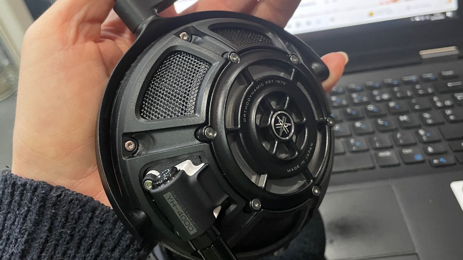 A selection of headphones, including the Audio-Technica ATH-ADX7000 worn by a man in Paris