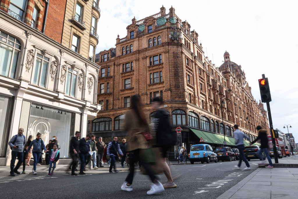 LONDON, ENGLAND - APRIL 22: Pedestrians cross the street near Harrods luxury department store on April 22, 2022 in London, England. The country's Office of National Statistics reported today that retail sales dropped 1.4% in March as the UK's rising cost of living affected consumer spending. (Photo by Hollie Adams/Getty Images)